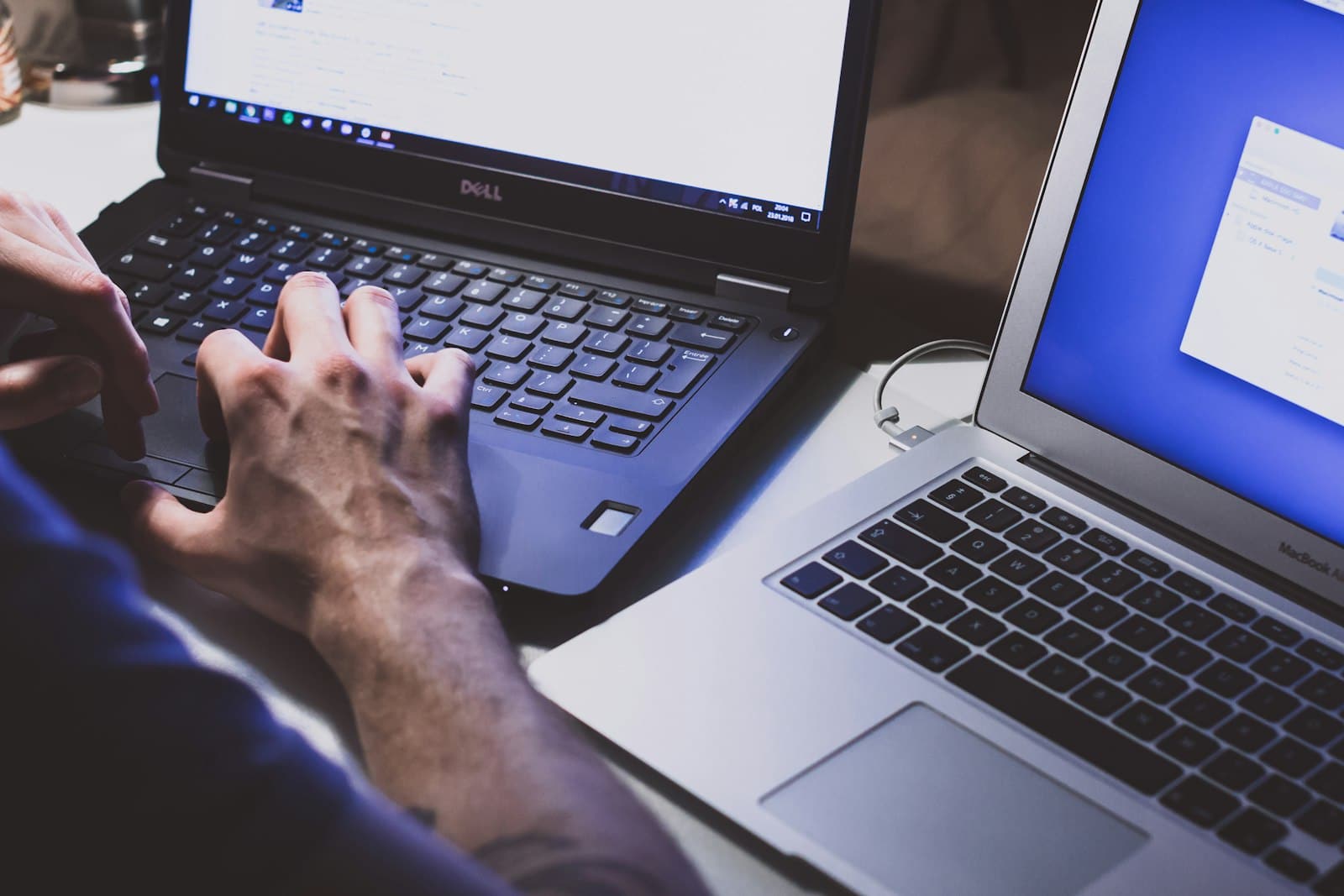 Keyboard lit at night while a small business owner replies to customer reviews