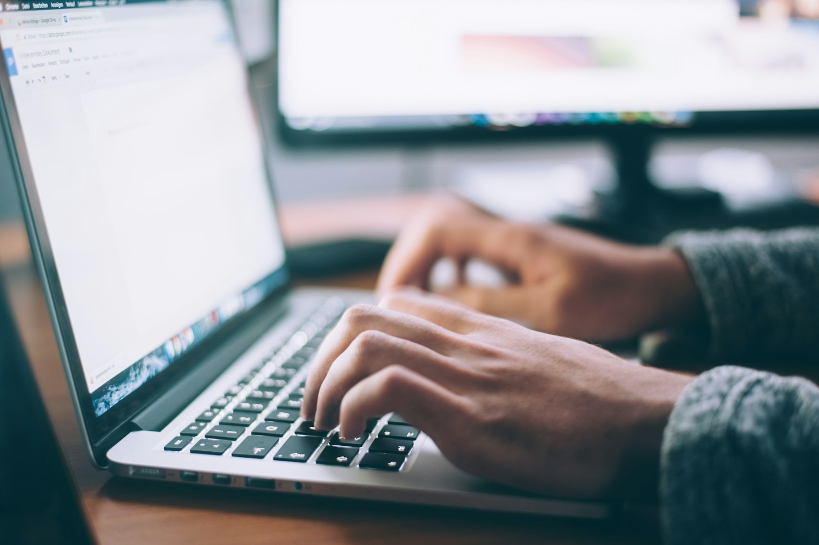 Small business owner reviewing website ownership and account access on a laptop in Cochrane, Alberta